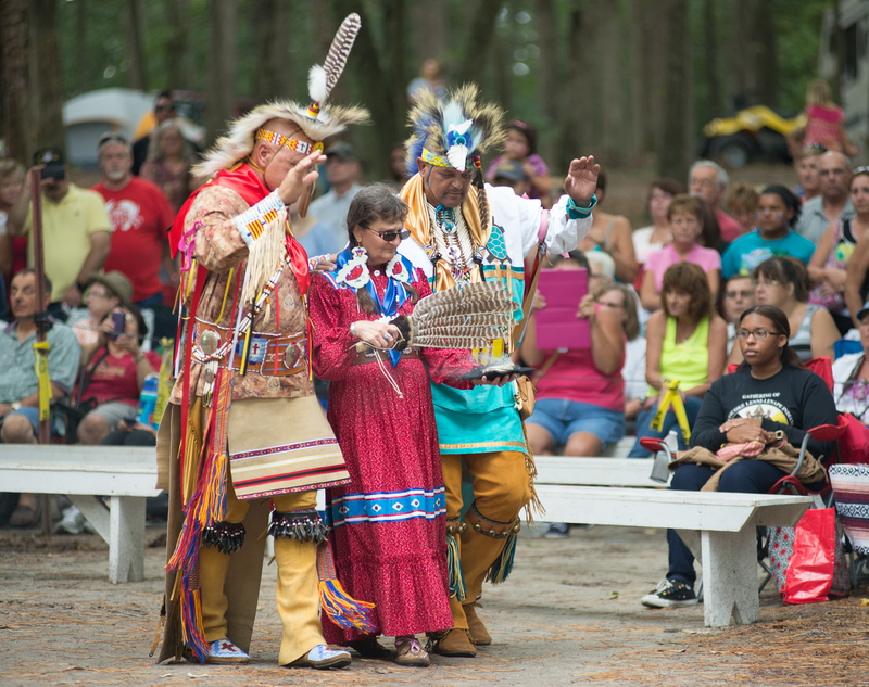 Larry Jackson, I(l-r) Ragghi Rain and Herbert Jackson walk the circle while an offering of burning sage and tobaaco is fanned in the dance circle. BY DENY HOWETH